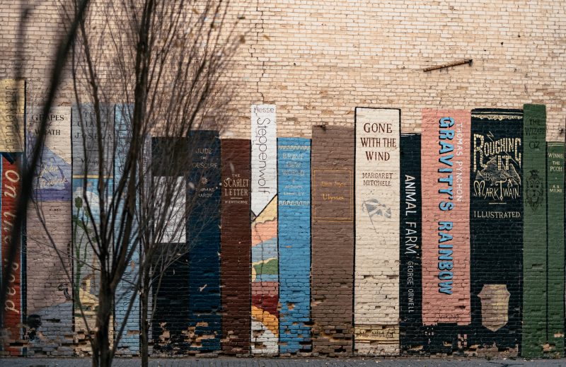 book art mural on wall in Utah with Mark Twain book among other classics