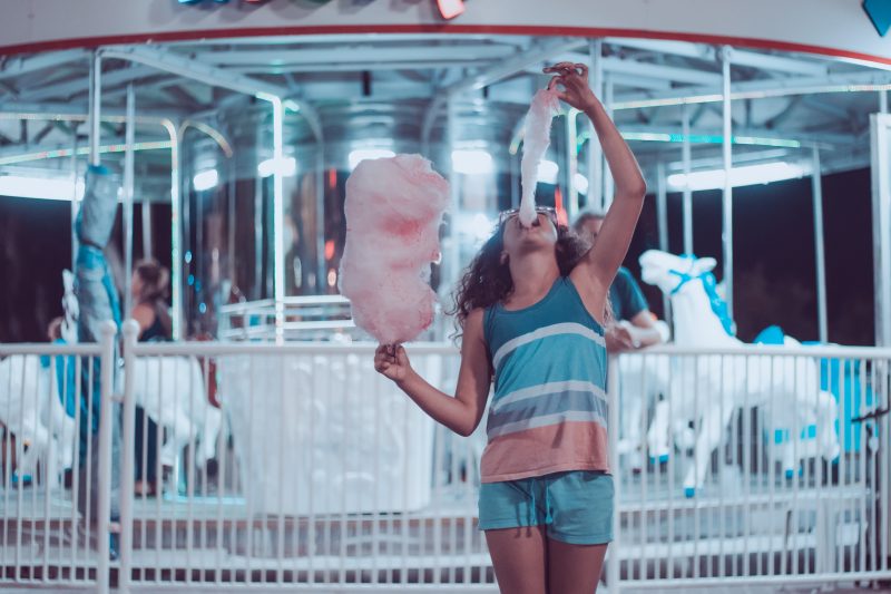 woman spiking her insulin levels eating cotton candy - blog post with quote to remember about anxiety and depression